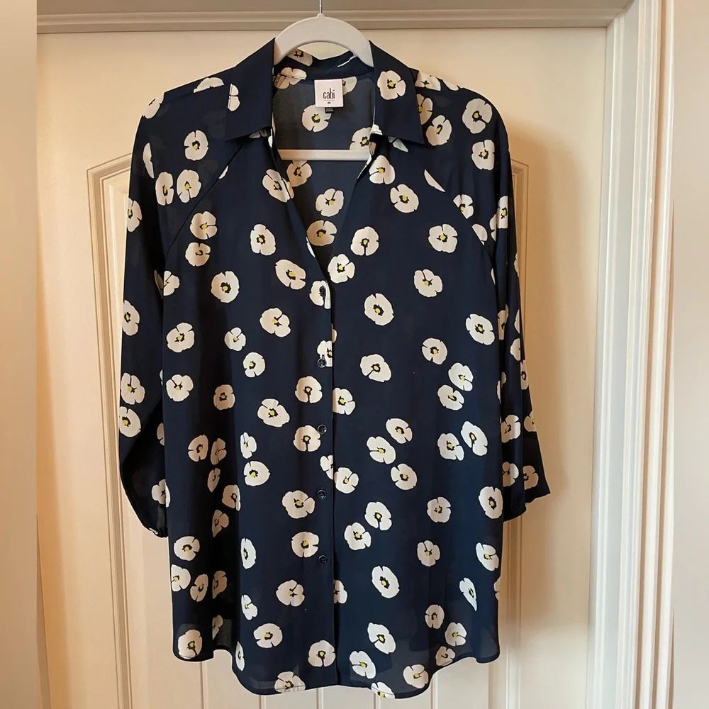 CAbi navy blouse with flower accents.  Size medium